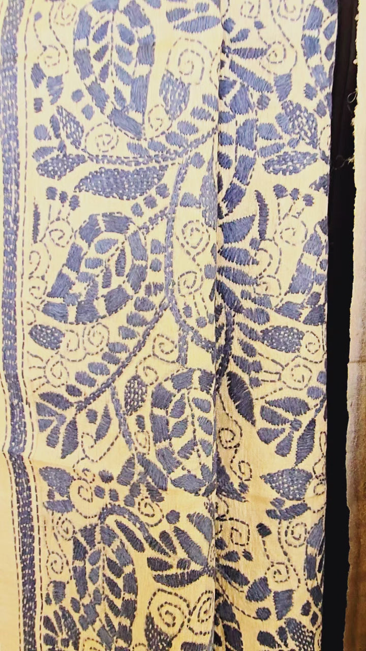Delicate grey kantha embroidery showing heritage floral pattern on beige silk